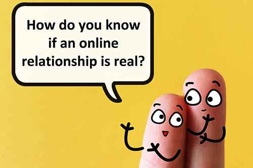 Image of two fingers with smiley faces saying "How do you know if an online relationship is real?"
